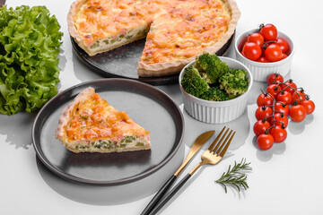 Delicious fresh quiche with broccoli, salmon and cheese