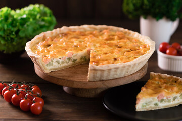 Delicious fresh quiche with broccoli, salmon and cheese