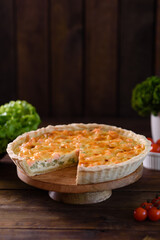 Delicious fresh quiche with broccoli, salmon and cheese