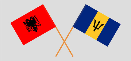 Crossed flags of Albania and Barbados. Official colors. Correct proportion
