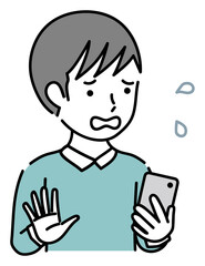 スマホを操作する困っている男性ビジネスパーソン