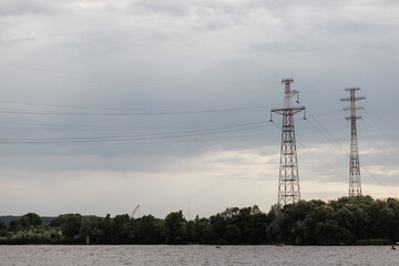  Pylons for the transmission of high voltage electricity from a power plant near the water