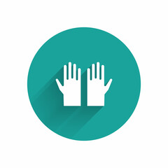 White Medical rubber gloves icon isolated with long shadow. Protective rubber gloves. Green circle button. Vector