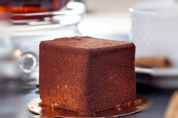 delicious chocolate cake with a cube shape on the table