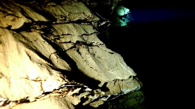 Budapest - 17 August 2017: Technical diver in red flippers in the underwater cave of Budapest