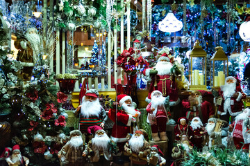 many Santas and Christmas trees in the window