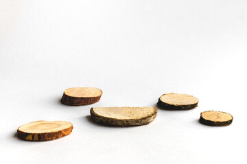 Five different podiums made of natural wood for advertising on a white background, with a place for text