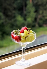 closeup fresh fruits and berries on the glass dessert food organic diet yummy berry healthy juice strawberry grapes cherry