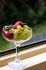 Closeup fresh fruits and berries in hand food organic strawberry green grapes dessert fruit salad summer diet healthy berry berries nobody tasty eat