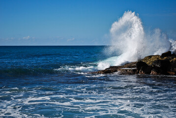 waves crashing on rocks