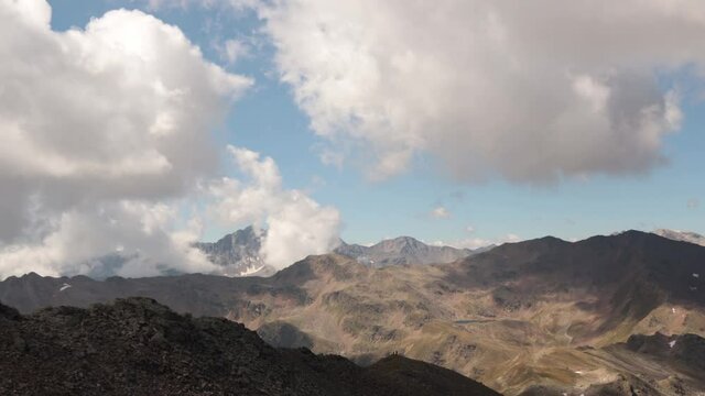 4K timelapse footage_Mountains above Resia Pass in Italy - clouds moving fast