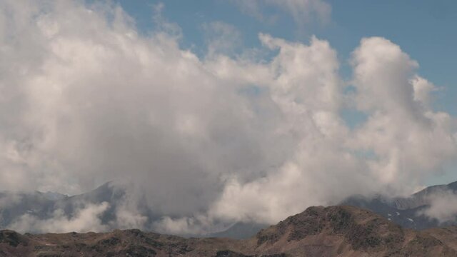 4K timelapse footage_Mountains above Resia Pass in Italy - clouds background