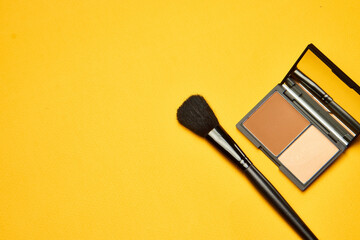 cosmetics mascara brushes decoration accessories yellow background