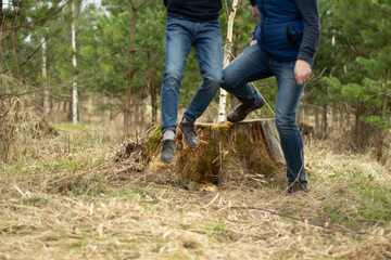 Two men in jeans. Fashion in clothes in autumn. Guys move freely.