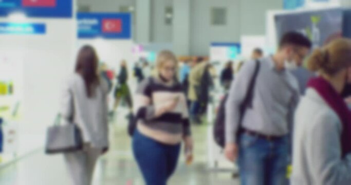 blurred defocused video. unrecognizable people in the lobby of a large modern building. business background.