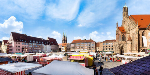 Nuremberg, Marketplace with cathedral and market stalls on a sunny day in Autumn