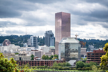 Down town of Portland with high-rise office buildings and apartments against a stormy sky.