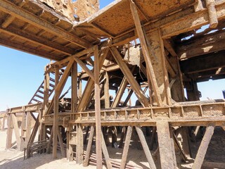 Abandoned Oil Rig Machinery During Sand Storm in the Desert