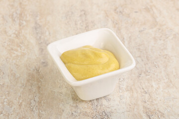 Organic mustard sauce in the bowl