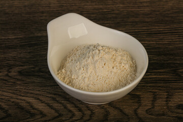 Wheat flour heap in the bowl