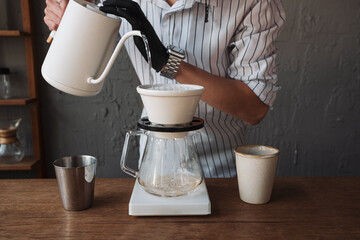 barista dripping coffee and slow coffee bar style
