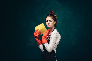 cleaning lady in red rubber gloves with a rag in her hands housekeeping