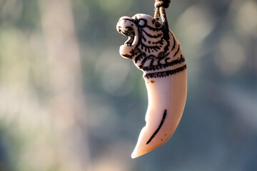 Pendant in front of the car made of ivory