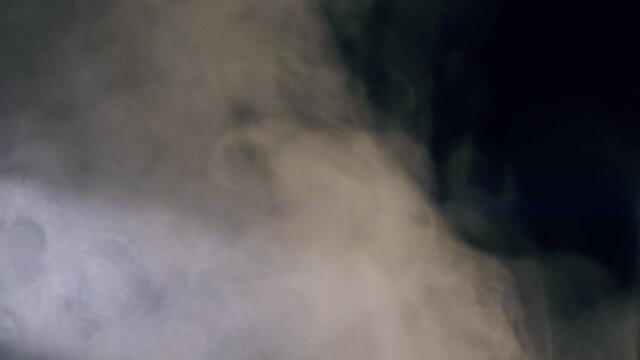 Slow motion white abstract smoke, fog, steam cloud isolated on black background