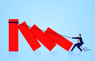 The businessman uses a rope to enclose the bar graph and tries to avoid the domino effect.