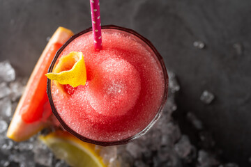 Luxury cocktail and cocktail shaker on black stone background