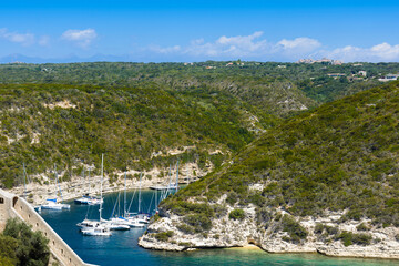 Fototapeta premium Arbor, boats, landscape and blue sky at Bonifacio, Corsica