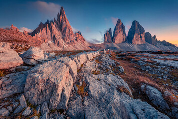Obraz premium Fantastic autumn sunset in Tre Cime Di Lavaredo National park with Paternkofel Peak. Unbelievable evenig scene of Dolomite Alps, Italy, Europe. Beauty of nature concept background.