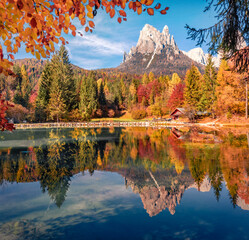 Awesome autumn view of Welsperg lake. Great morning scene of Tonadico, Province of Trento, Italy, Europe. Colorful landscape of Dolomite Alps. Beauty of nature concept background.