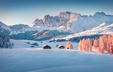 Captivating morning view of Alpe di Siusi village. Impressive winter scene of Dolomite Alps. Spectacular landscape of ski resort, Ityaly, Europe. Beauty of nature concept background.