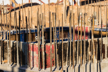 Reinforced concrete foundation of a modern monolithic residential building. Prepared formwork with reinforcing mesh for pouring concrete. Monolithic construction technologies.