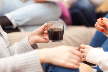 Two girls friends drinking coffee