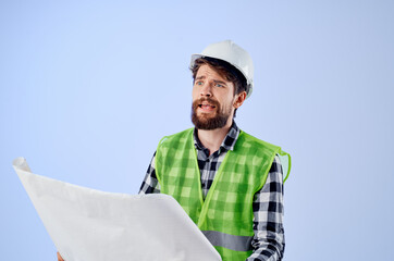 male builder with documents and drawings blueprints isolated background