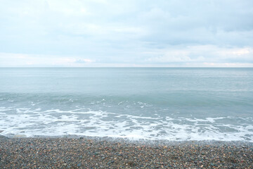 pebbles on the black sea coast. small waves on the shores of the black sea covered with pebbles