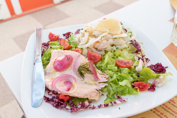 Seafood salad with salmon and vegetables