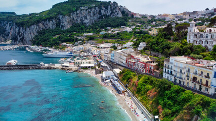 Beautiful coastline of Capri along the port area. Aerial view from drone.