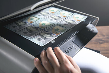 Man copying a money on a copy machine.