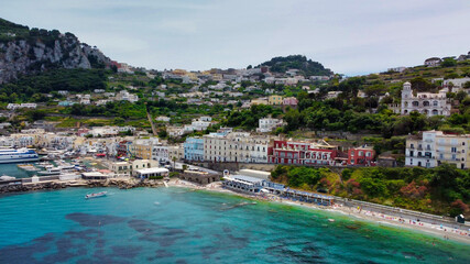 Fototapeta na wymiar Beautiful coastline of Capri along the port area. Aerial view from drone.