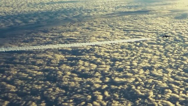 The plane is flying with an inversion trail
