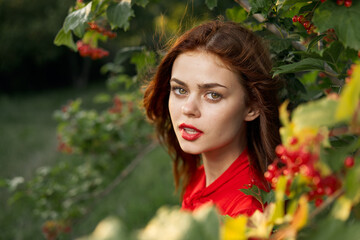 Naklejka premium beautiful woman bush with berries nature fresh air