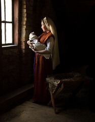 Mary in the stable near the manger with the baby