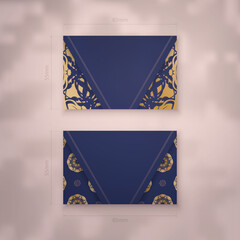 Business card in dark blue with luxurious gold ornaments for your contacts.