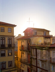 Evening sun shines over the roof of the old house. Porto, Portugal
