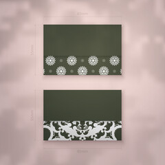 Business card in dark green color with mandala white ornament for your business.