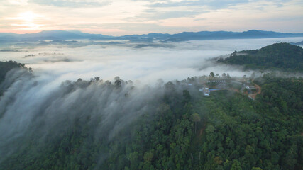 aerial view mist above the mountain in tropical rainforest and .beautiful sunrise scenery view in Phang Nga valley.
