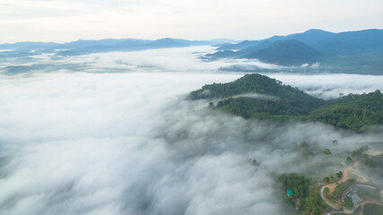 aerial view mist above the mountain in tropical rainforest and .beautiful sunrise scenery view in Phang Nga valley.